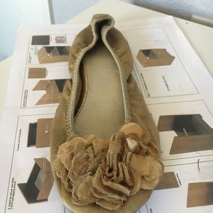 Soft golden slippers/flats.